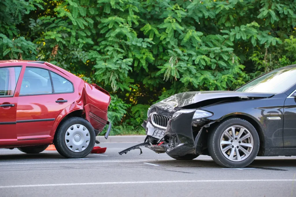 Damaged cars on the roadside after a crash