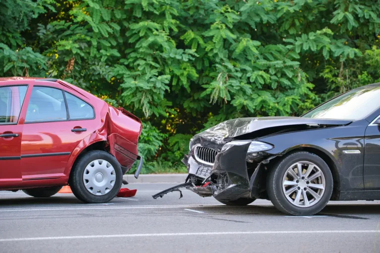 Damaged cars on the roadside after a crash