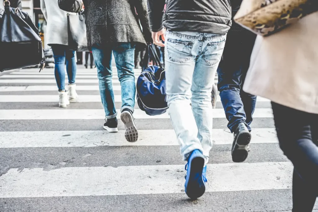 People walking across a crosswalk