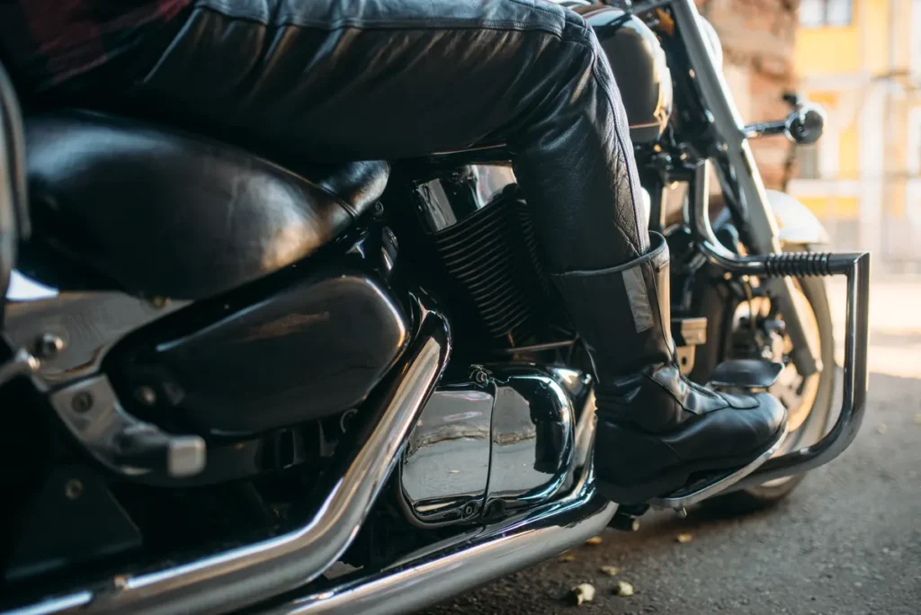 Close-up of a rider in leather on a cruiser motorcycle