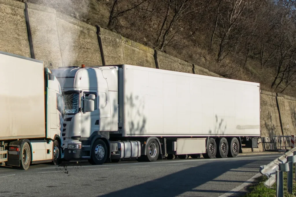 Damaged semi-truck stopped on a highway after a crash