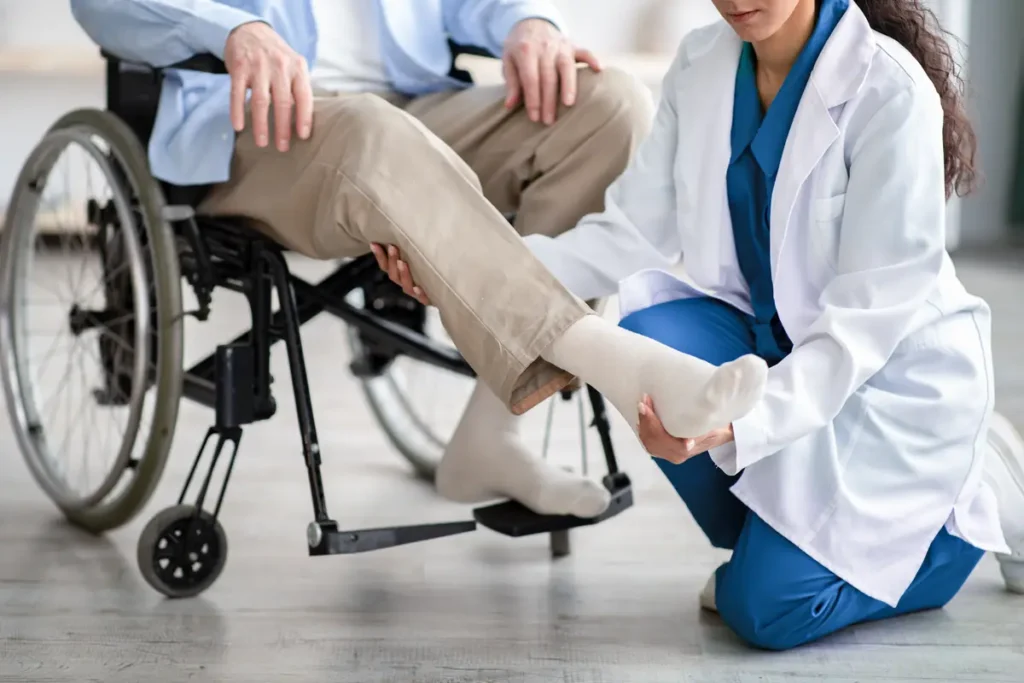 Medical professional helps a patient in a wheelchair