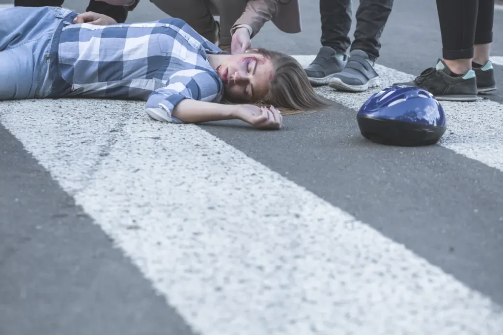 Woman lying in a crosswalk after being hit