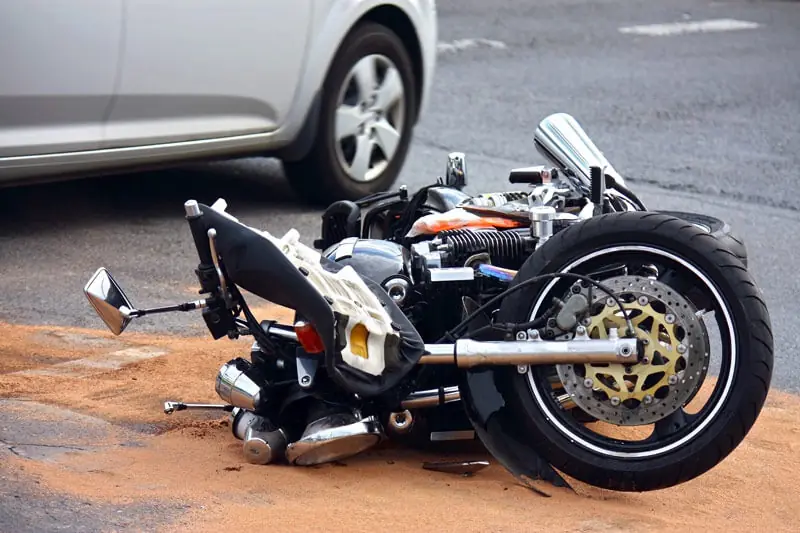 Motorcycle lying on its side after a crash