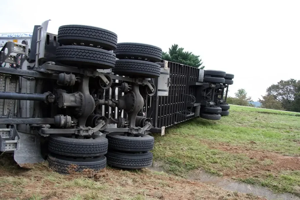 Overturned semi-truck trailer in a field